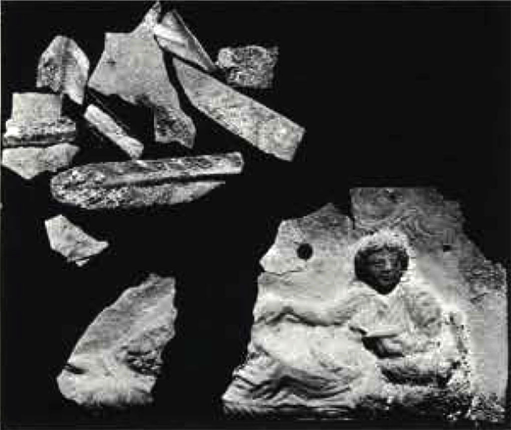 Boscoreale, Villa rustica in via Casone Grotta, proprietà Risi di Prisco. Lararium. Silver sheet with reclining female figure, as found.
See Rivista di Studi Pompeiani I, 1987, fig.27, p. 165.
