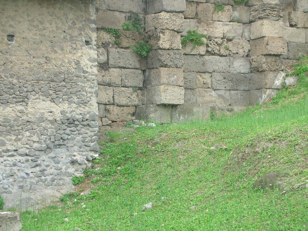 Tower XI, Pompeii. May 2010. Detail of city wall on east side of base of Tower, on left. Photo courtesy of Ivo van der Graaff.