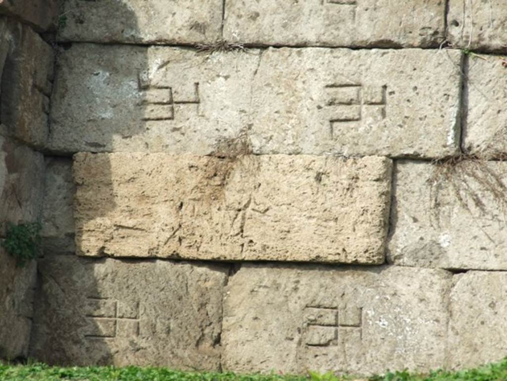 Pompeii city walls. December 2007. Masons marks on city walls adjacent to Tower XII. 