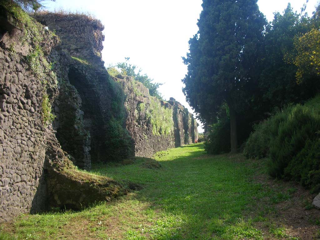 Walls on north side of Pompeii. May 2010. 
Base of Tower XII, on left. Looking west towards Herculaneum Gate. Photo courtesy of Ivo van der Graaff.
