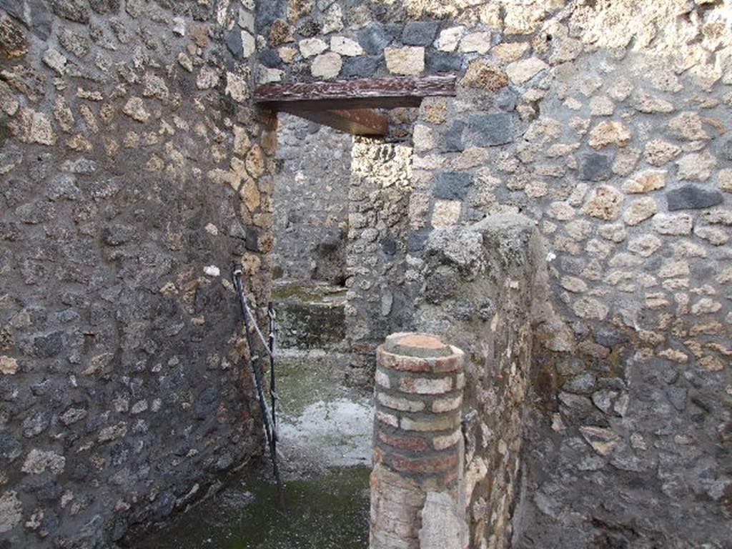 I.4.25 Pompeii. December 2006. Room 43, looking north into kitchen area, with small wall, centre right.