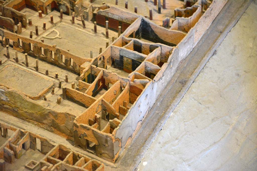 I.4.28 Pompeii. May 2019. Detail from model in Naples Archaeological Museum.
Looking north towards entrance doorway on corner of Vicolo del Menandro, and Vicolo del Citarista.
Foto Tobias Busen, ERC Grant 681269 DCOR.
