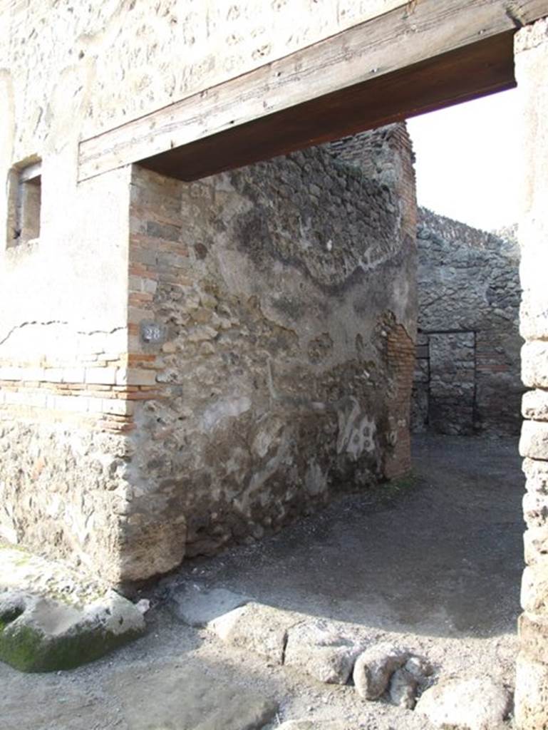 I.4.28 Pompeii. December 2007. Entrance with ramp, looking west.