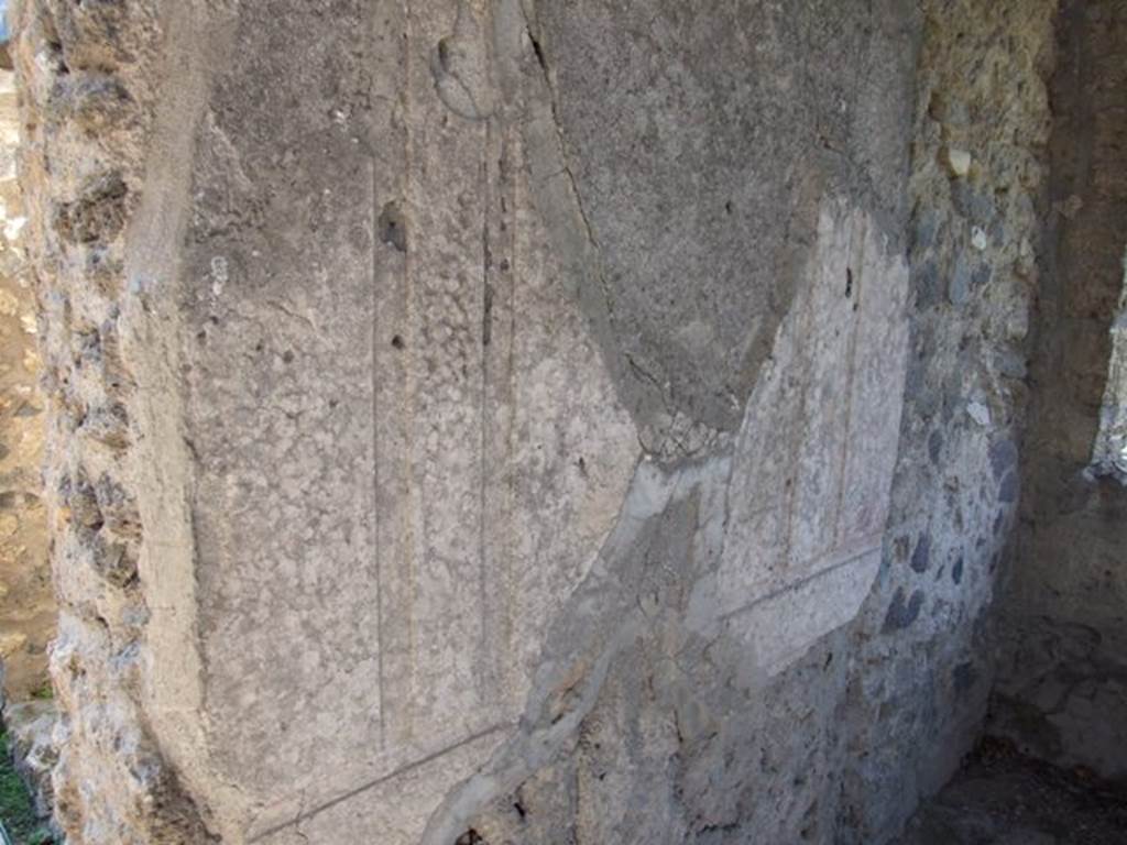 II.1.12 Pompeii.  March 2009.  Remains of plaster on south wall.