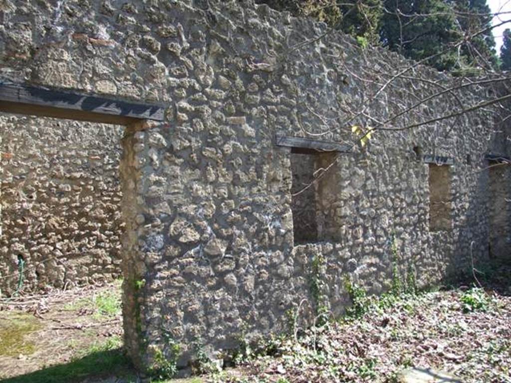 II.1.12 Pompeii.  March 2009.  Doorway and windows of rooms on the east side of the peristyle.