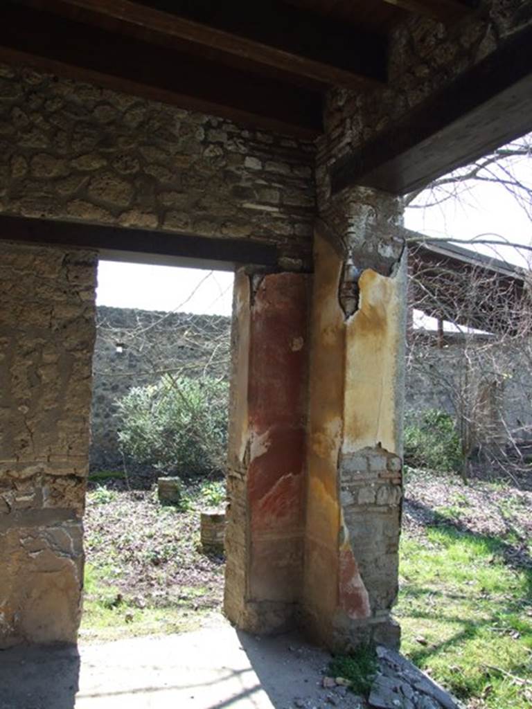 II.1.12 Pompeii.  March 2009. Sacellum.  Pillar on south side. Various graffiti were found on the pillars on each side of the door.  