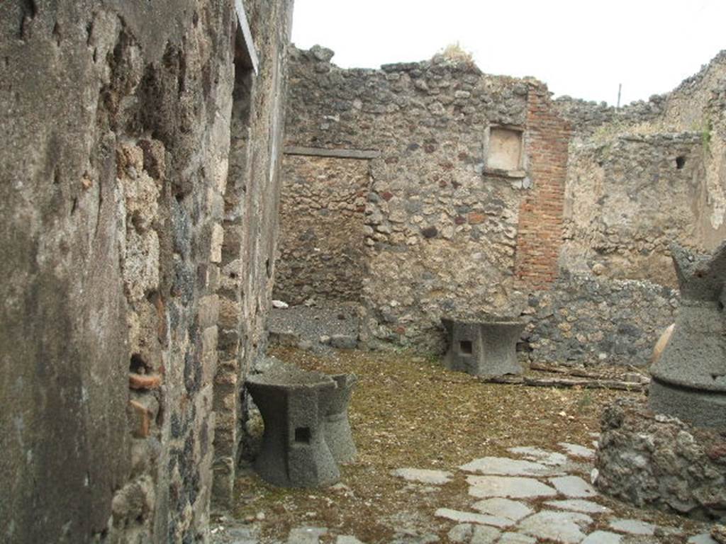 IX.3.20 Pompeii. May 2005. Room 1, looking west to room 9 and niche on west wall. 