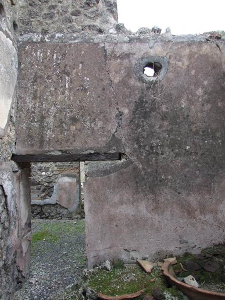 IX.3.20.  Bakery.  December 2007.  Room 4.  East wall and doorway with remains of two terracotta basins.